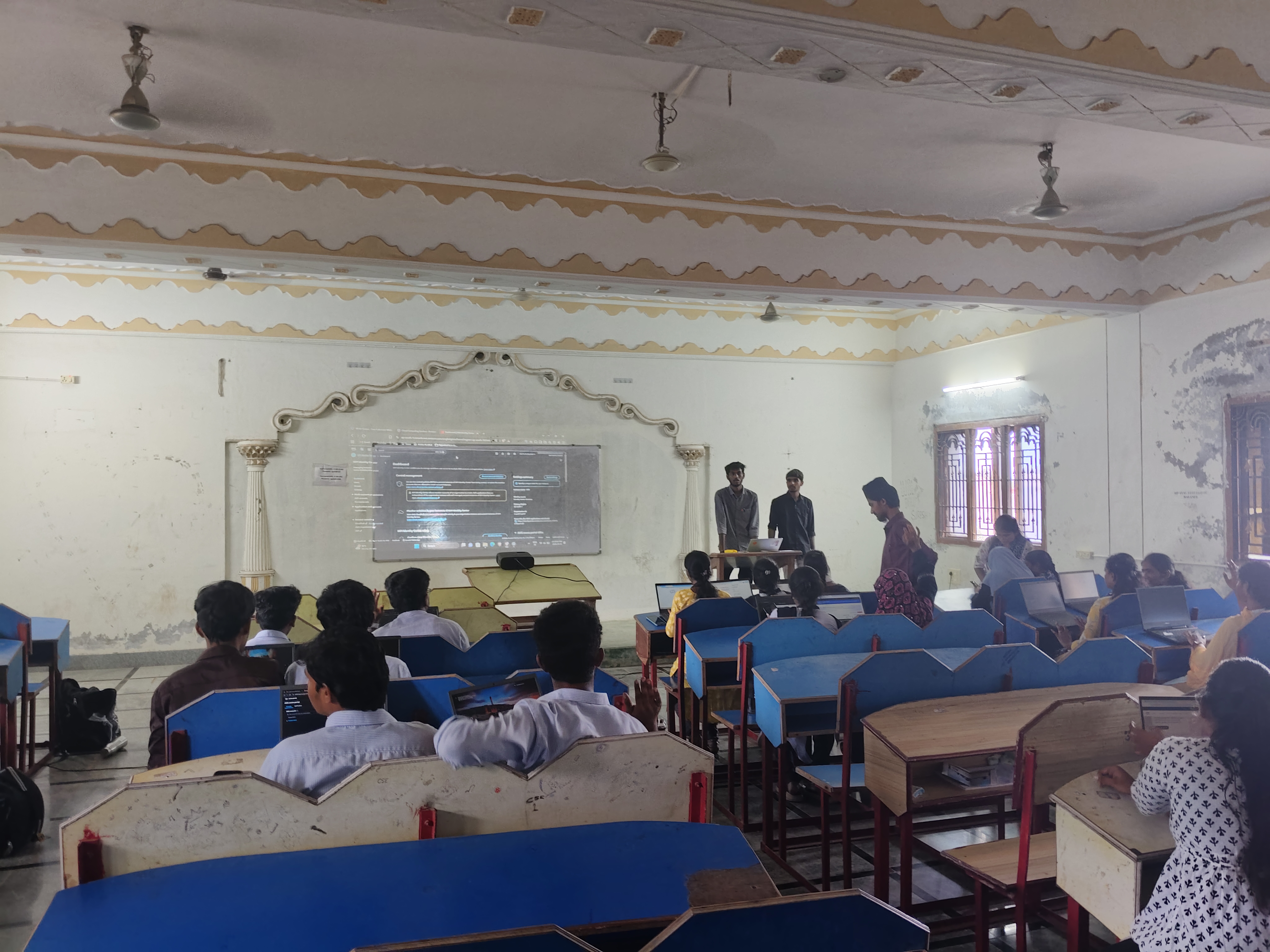 Student explaining slide presentation to judges